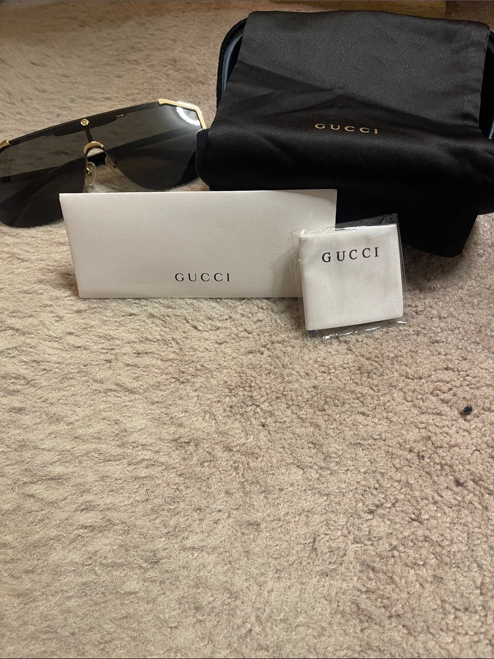 Gucci Black Lensed Shield Sunglasses with Gold Accents